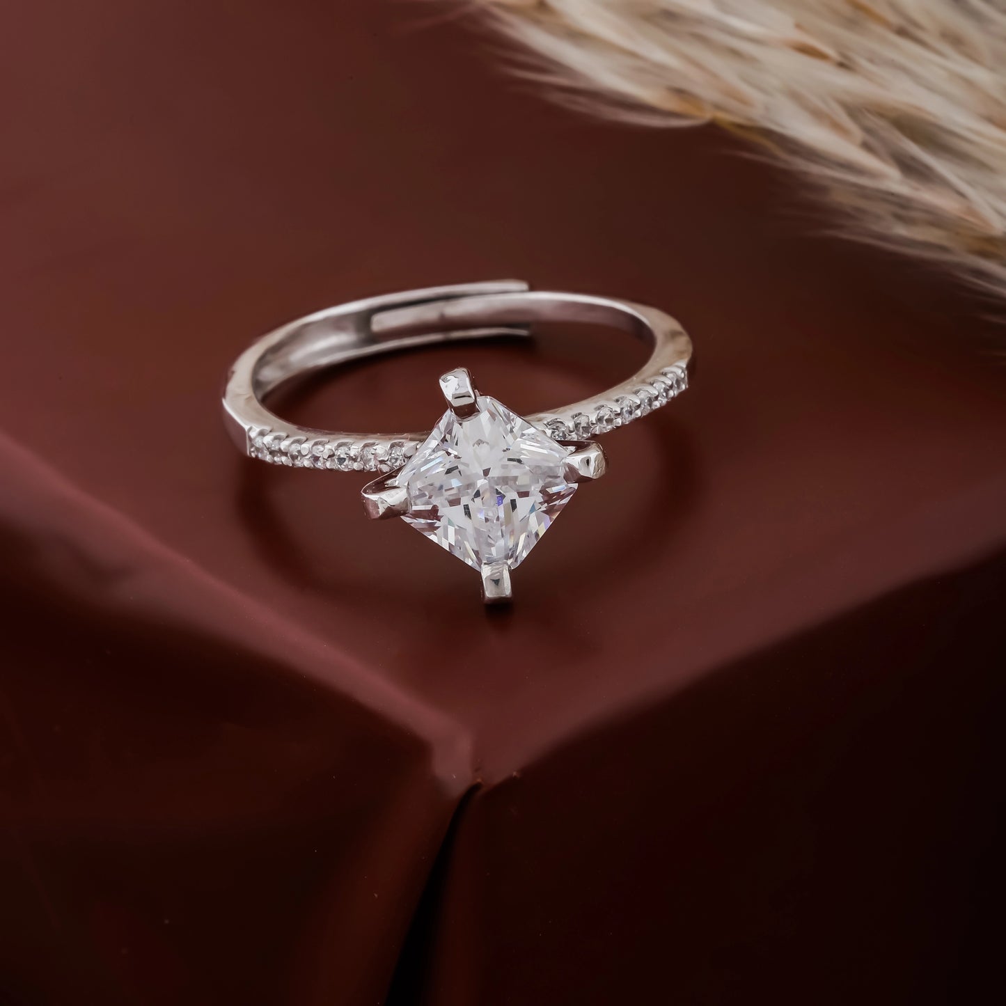 Diamond ring on a brown fabric background