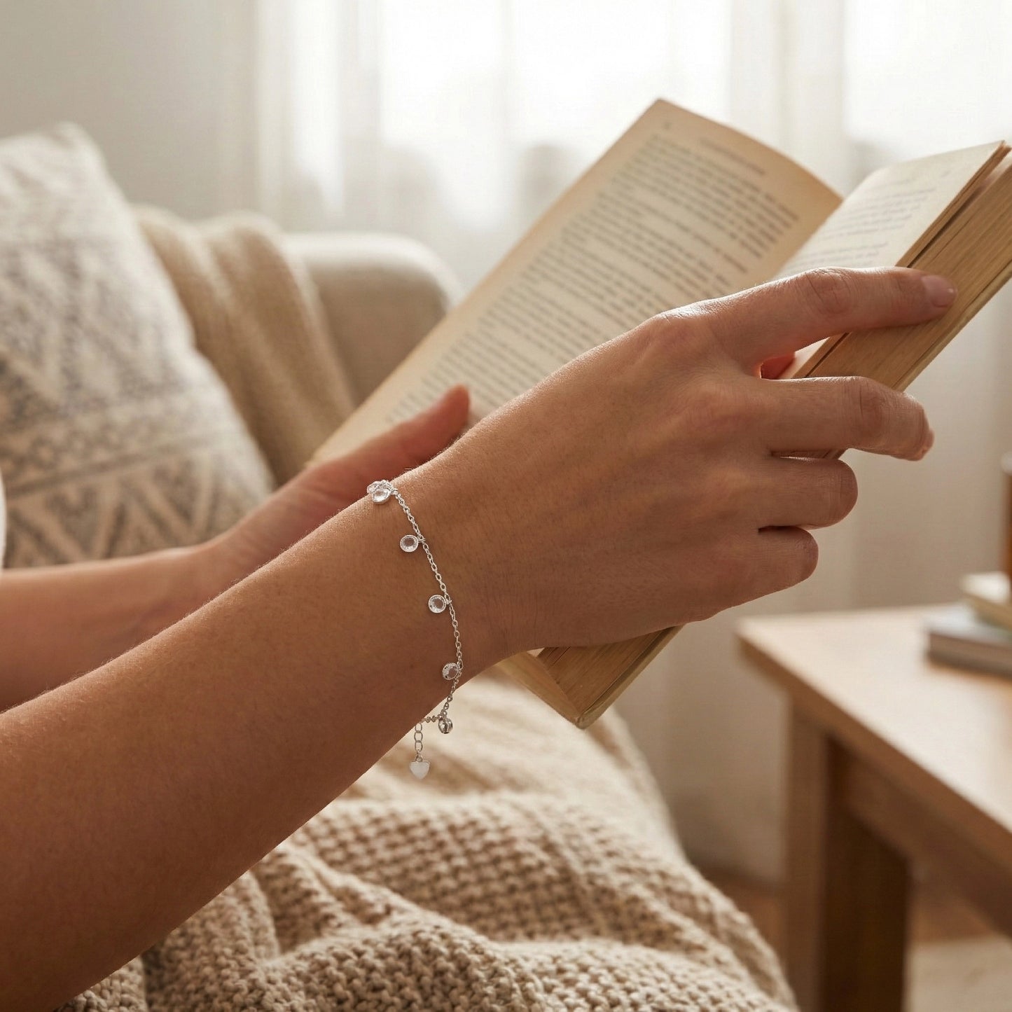 Sterling silver chain bracelet featuring transparent crystal beads