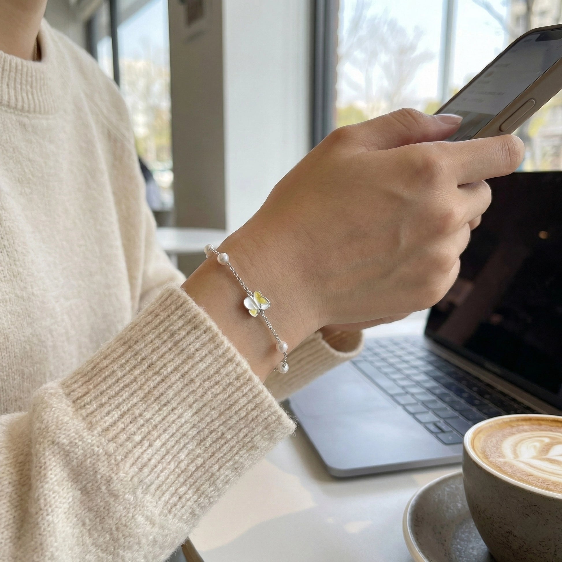Pearl station bracelet in 925 silver on dark red backdrop