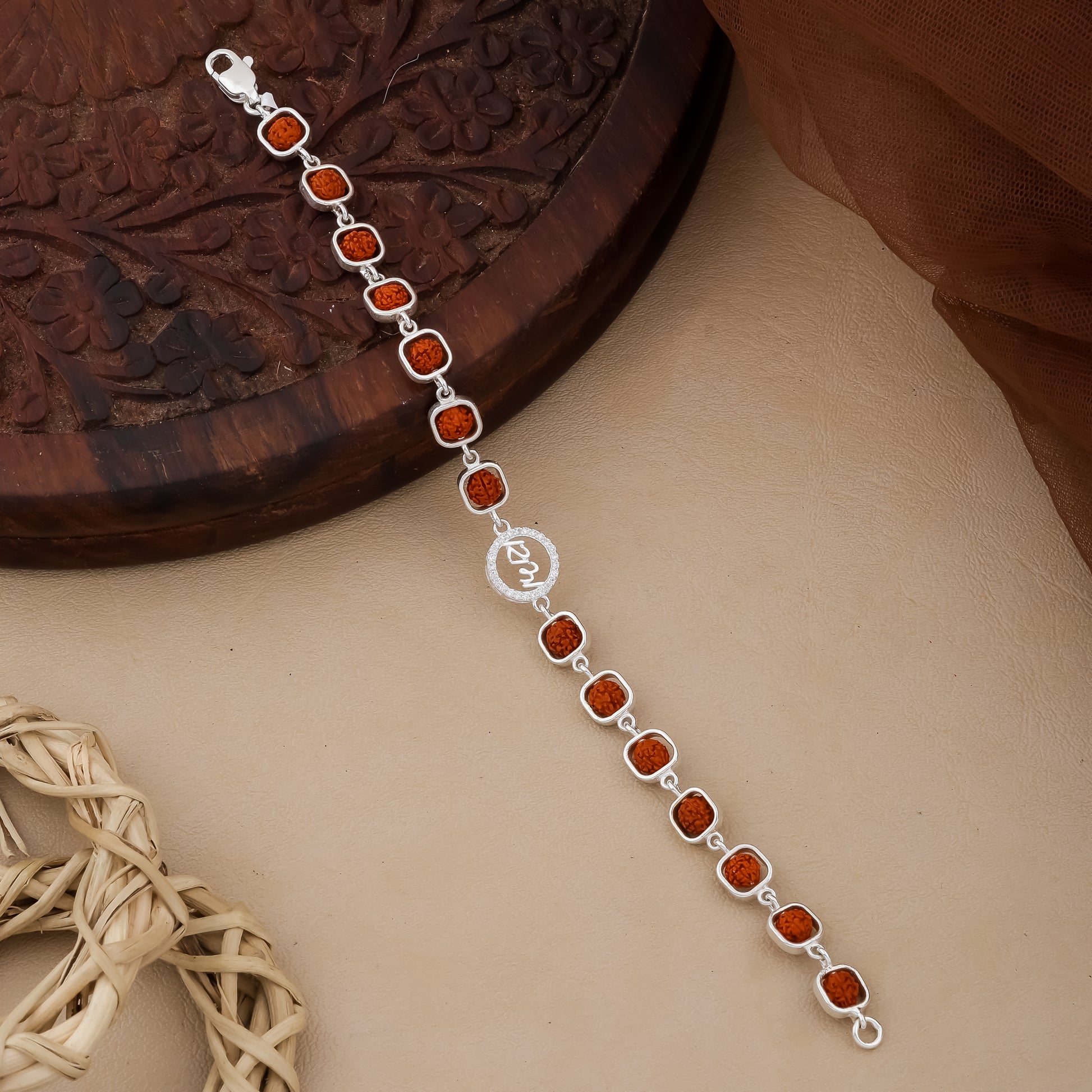 Man wearing 925 silver Rudraksha bracelet with Ram symbol and diamond accents