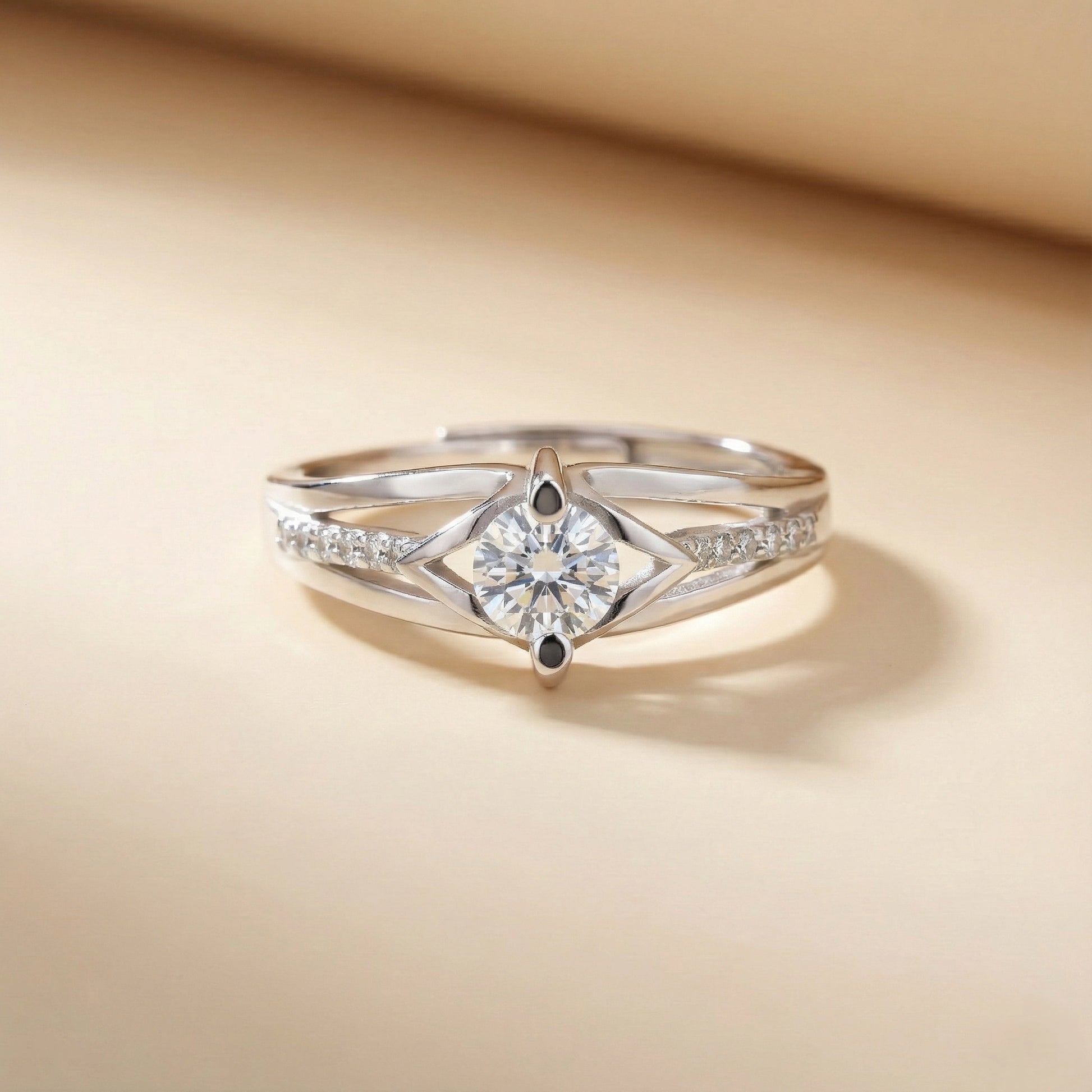 Silver ring with a diamond on a beige background