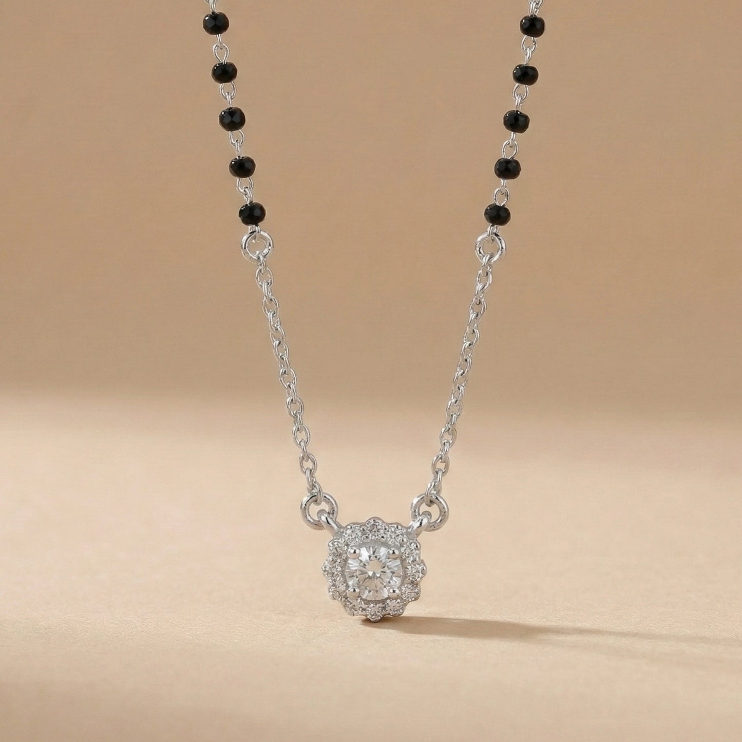 Black bead mangalsutra necklace with flower-shaped diamond pendant