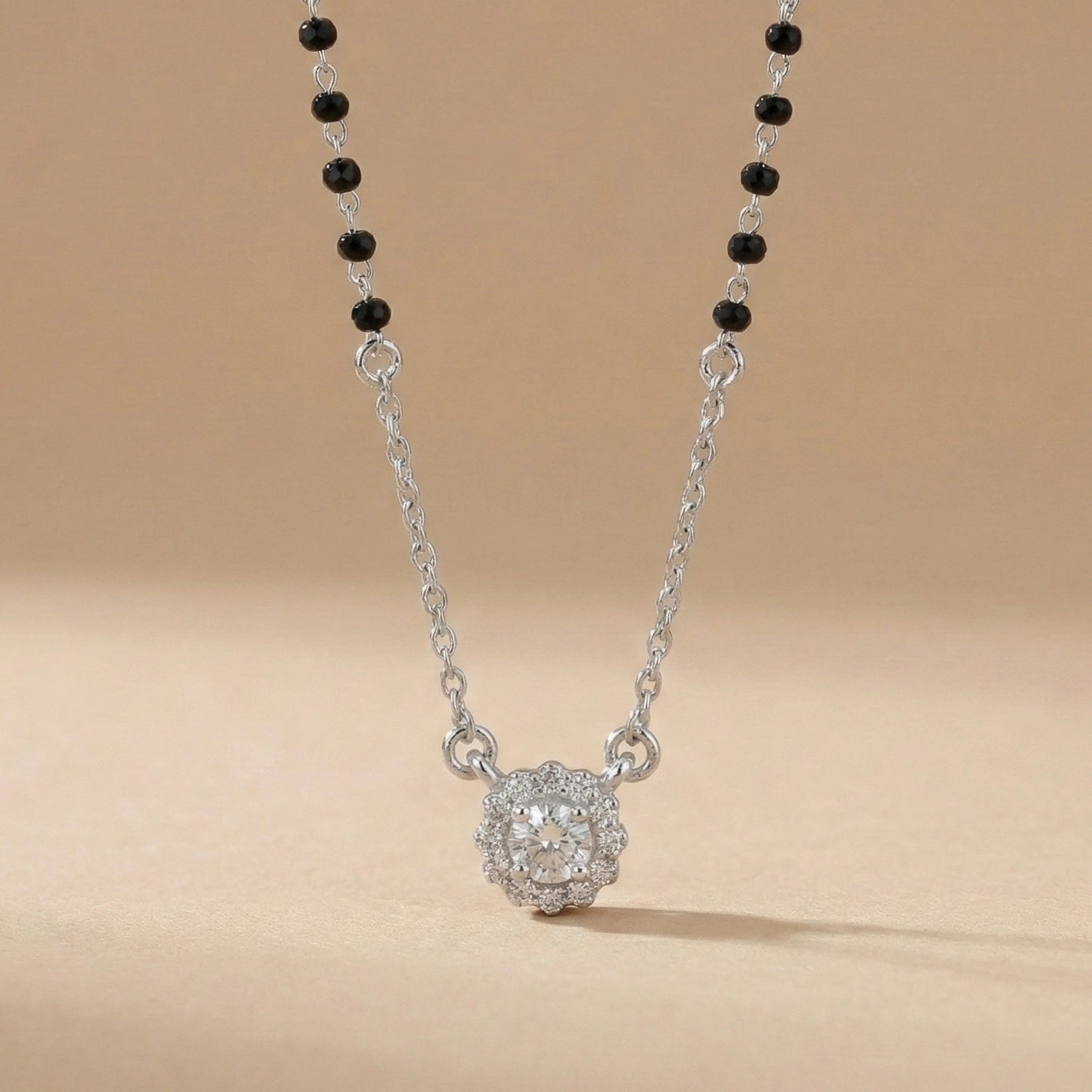 Black bead mangalsutra necklace with flower-shaped diamond pendant