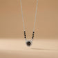 Contemporary mangalsutra with black beads and teardrop halo pendant