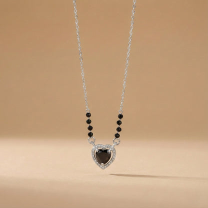 Contemporary mangalsutra with black beads and teardrop halo pendant