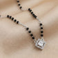 Silver mangalsutra with black beads and square diamond halo pendant