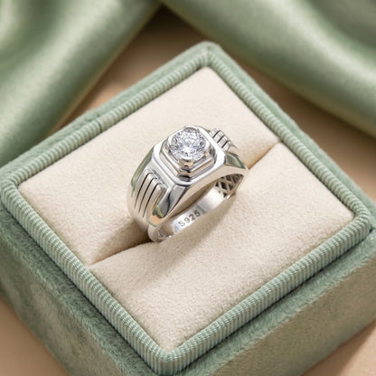 Silver ring with a diamond in a green velvet box