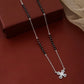 Contemporary mangalsutra with black beads and geometric cross pendant