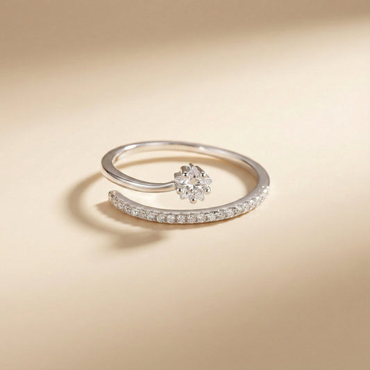 Silver ring with a floral design on a beige background