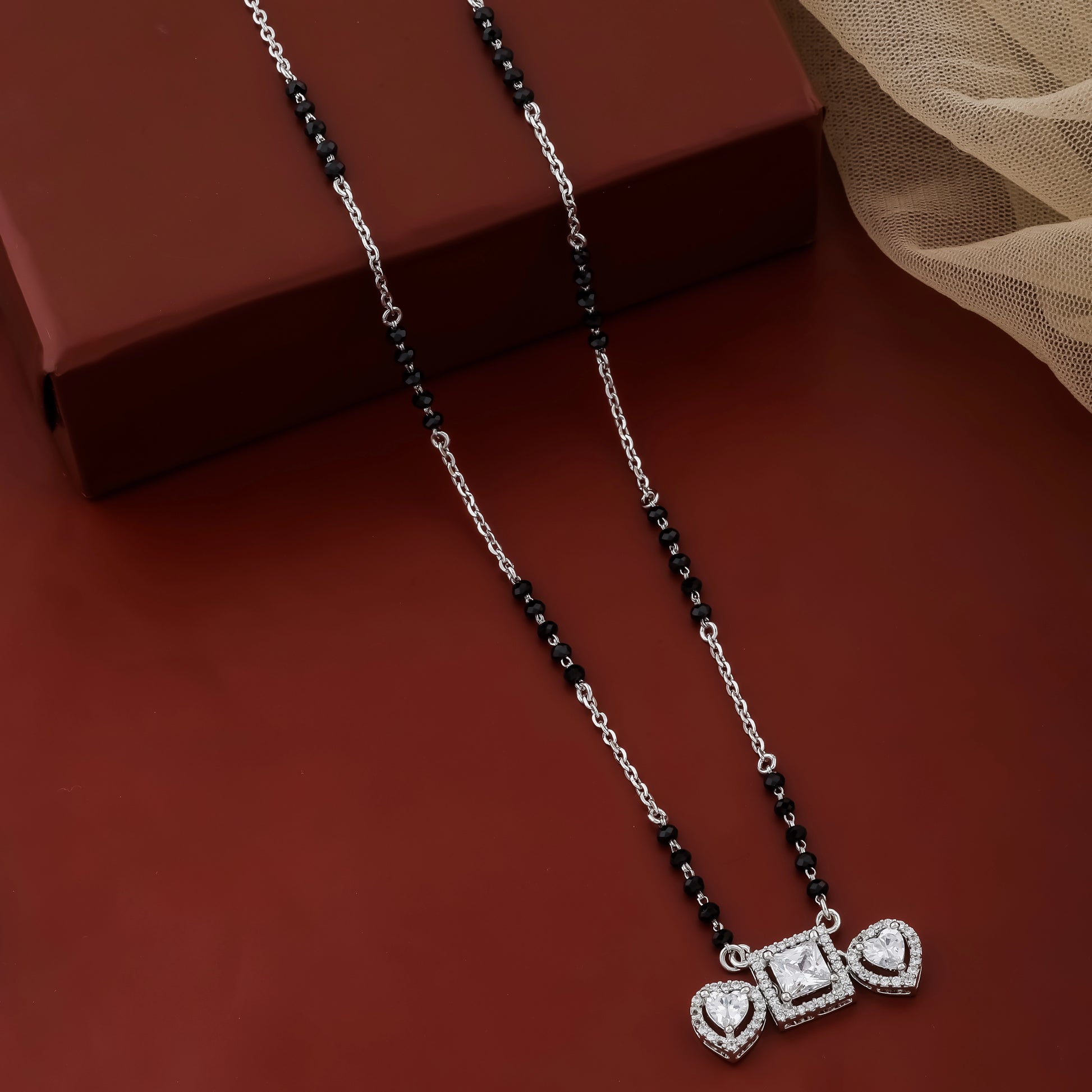 Necklace with a heart-shaped pendant on a brown surface