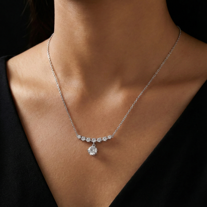 Diamond necklace on a person wearing a black top