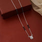 Contemporary mangalsutra with black beads and geometric halo pendant