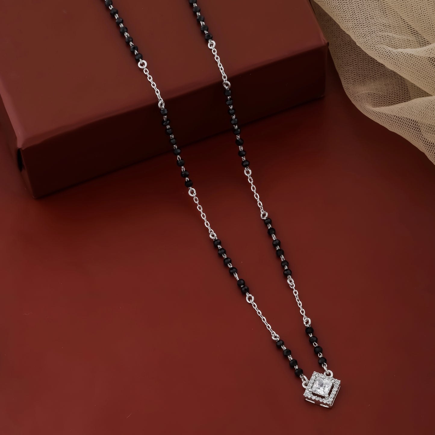 Modern silver mangalsutra featuring black beads and square pendant