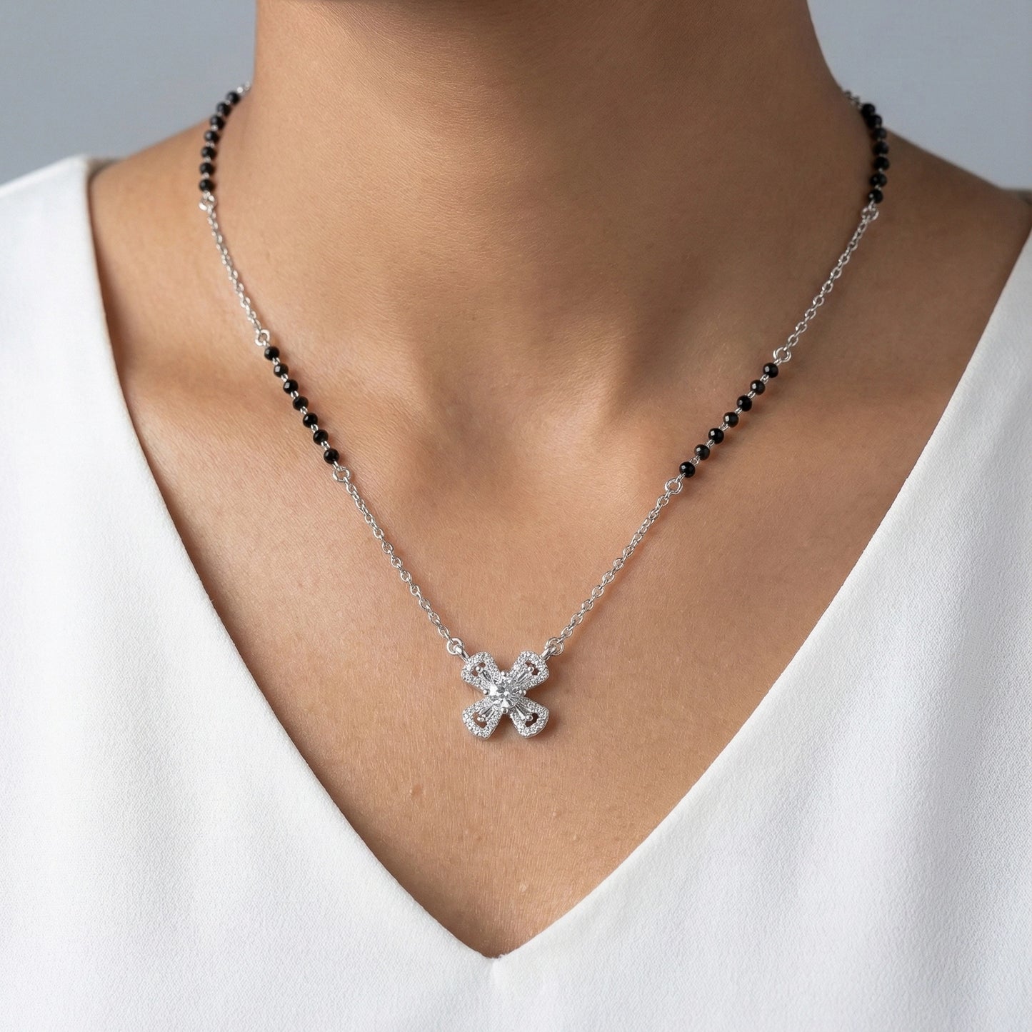Black bead mangalsutra necklace with diamond cross charm
