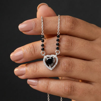 Modern silver mangalsutra featuring black beads and pear-shaped black stone pendant