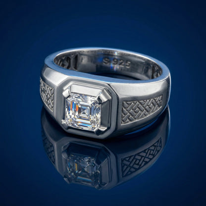 Silver ring with a diamond on a reflective blue surface
