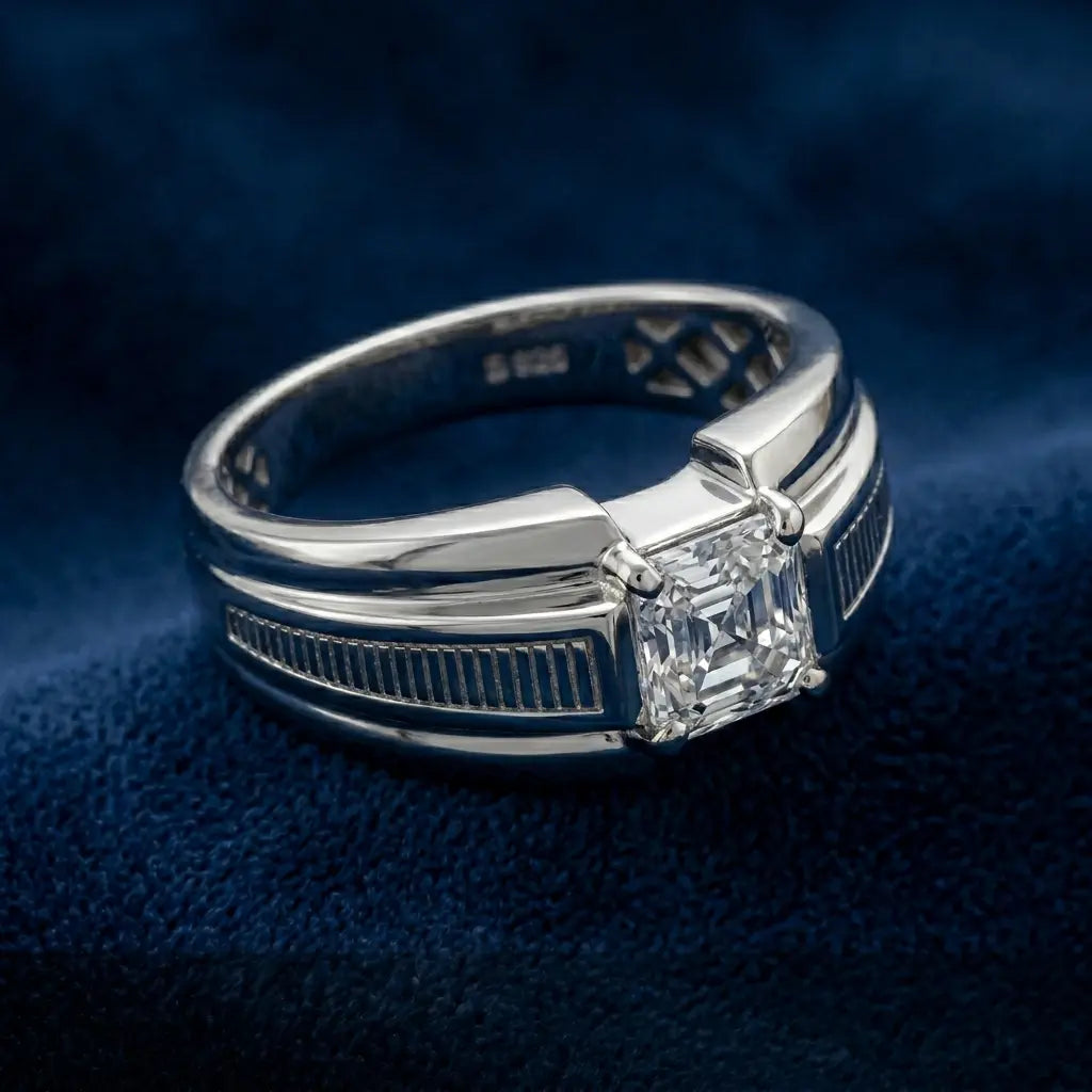 Silver ring with a diamond on a dark blue textured background