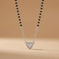 Modern silver mangalsutra featuring black beads and heart pendant