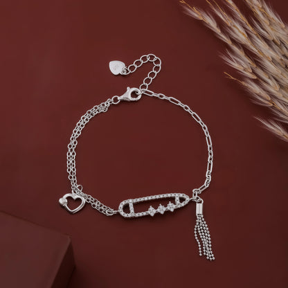 Silver bracelet with charms on a brown background
