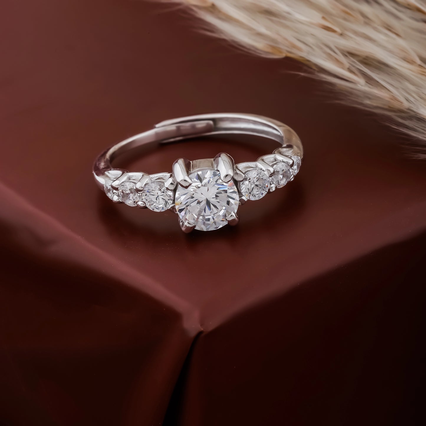 Diamond ring on a brown fabric background