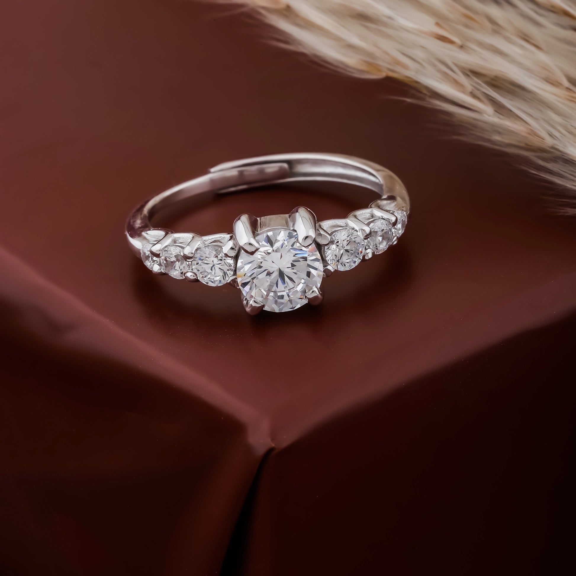 Diamond ring on a brown fabric background