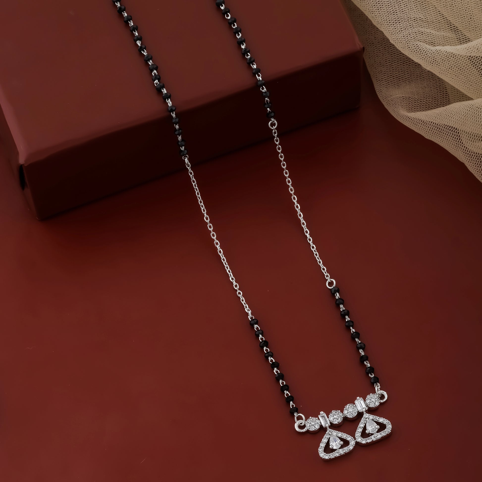 Contemporary mangalsutra with black beads and heart-shaped diamond design