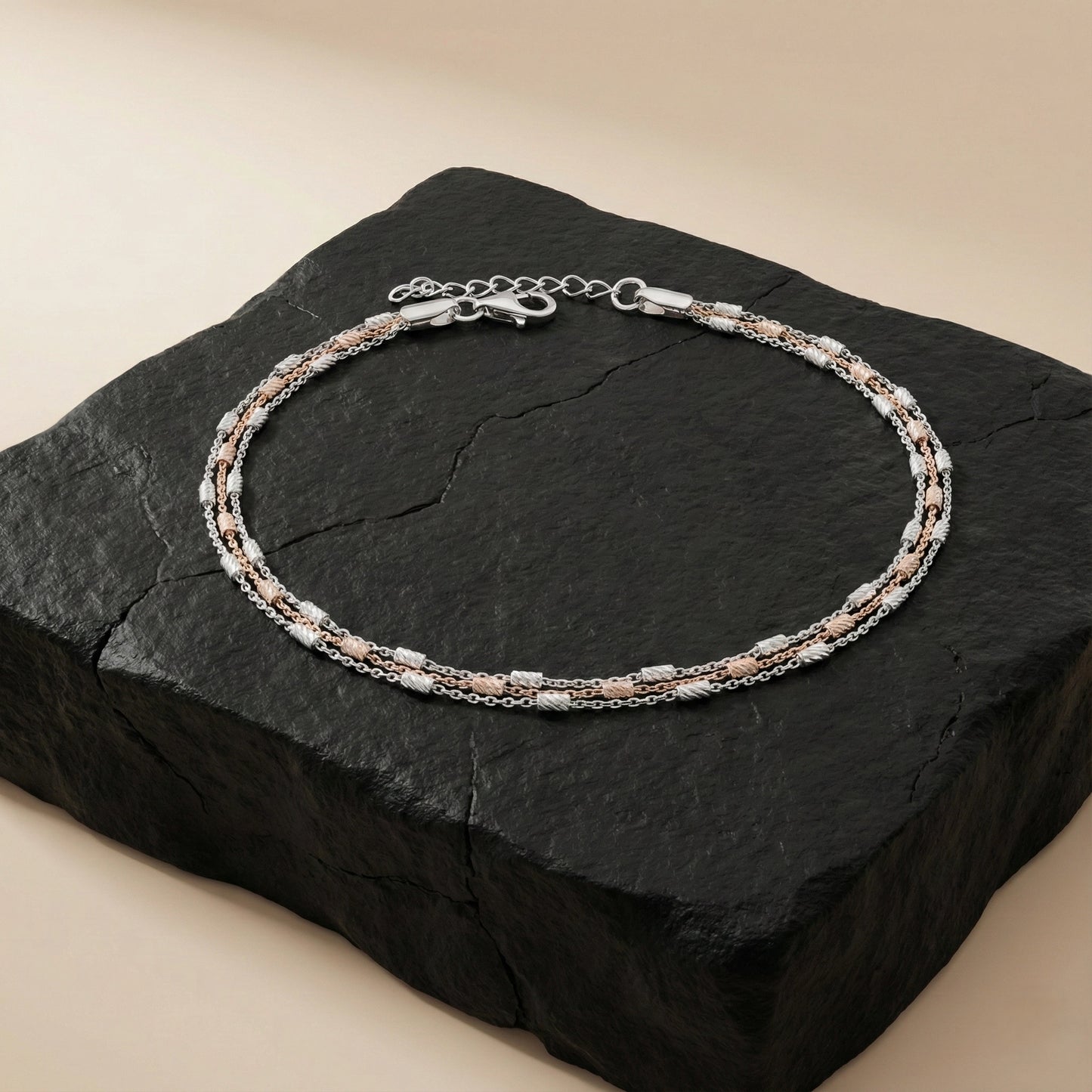 Silver bracelet on a black stone surface