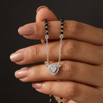 Contemporary mangalsutra with black beads and heart shaped stone