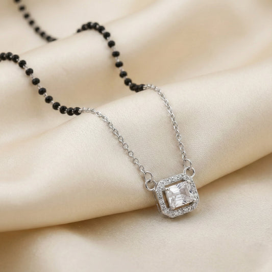 Silver mangalsutra with black beads and rectangular halo pendant