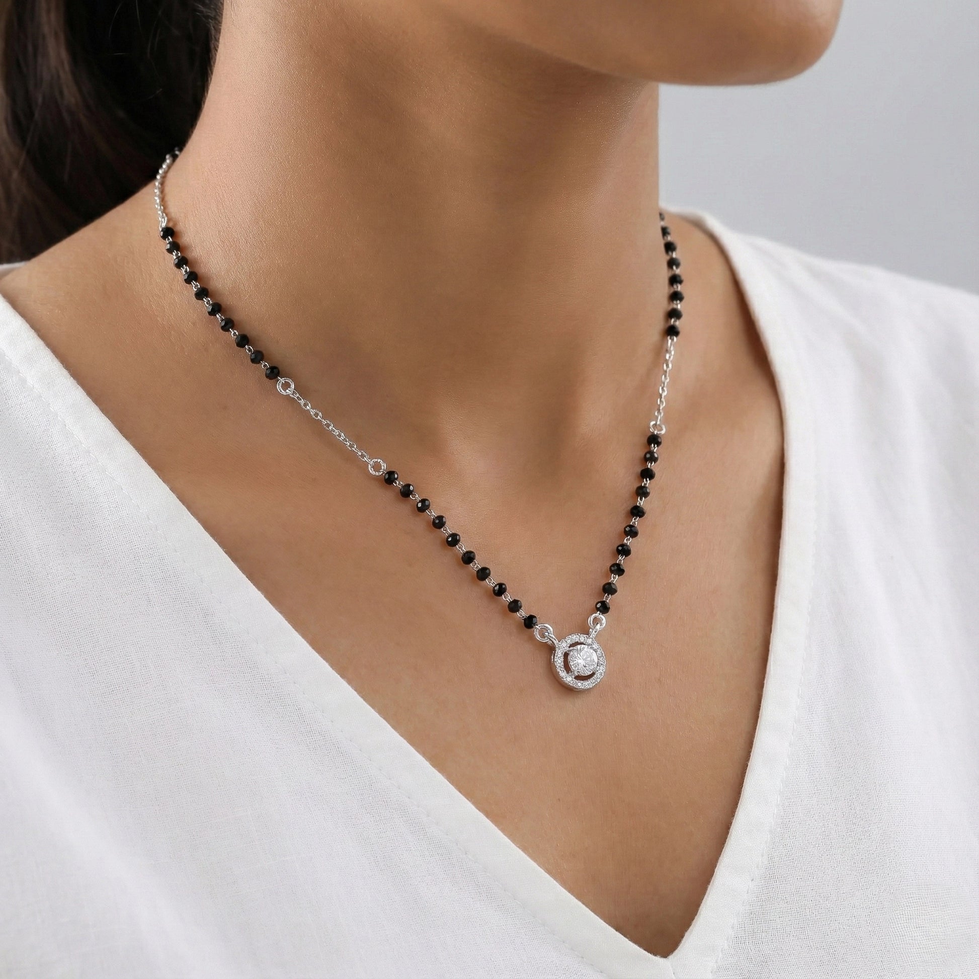 Minimal mangalsutra with silver chain and round stone pendant