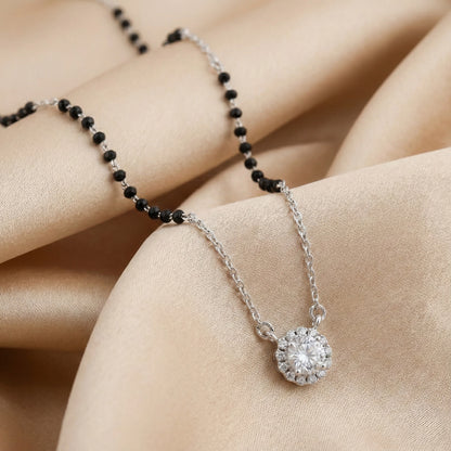 Silver mangalsutra with black beads and pear-shaped diamond halo pendant