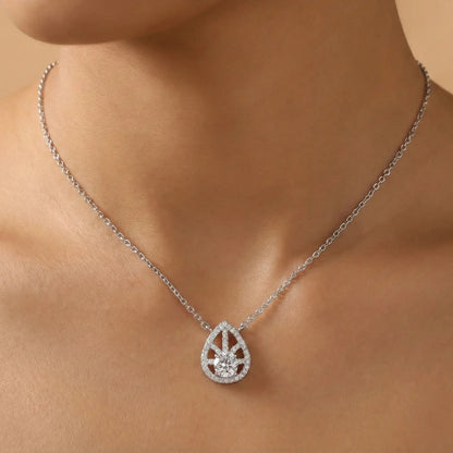 Teardrop-shaped diamond necklace on a person's neck