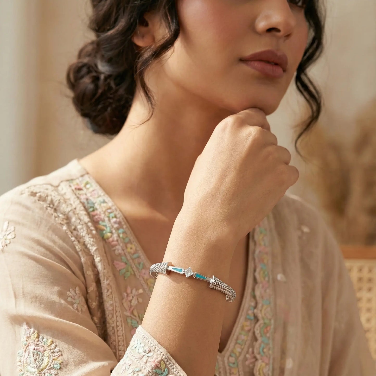 Woman wearing a bracelet with a blurred background