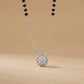 Diamond necklace with black beads on a beige background