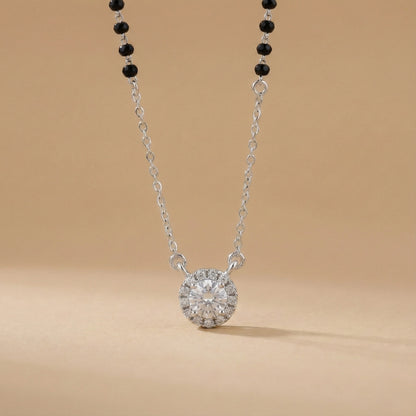 Diamond necklace with black beads on a beige background