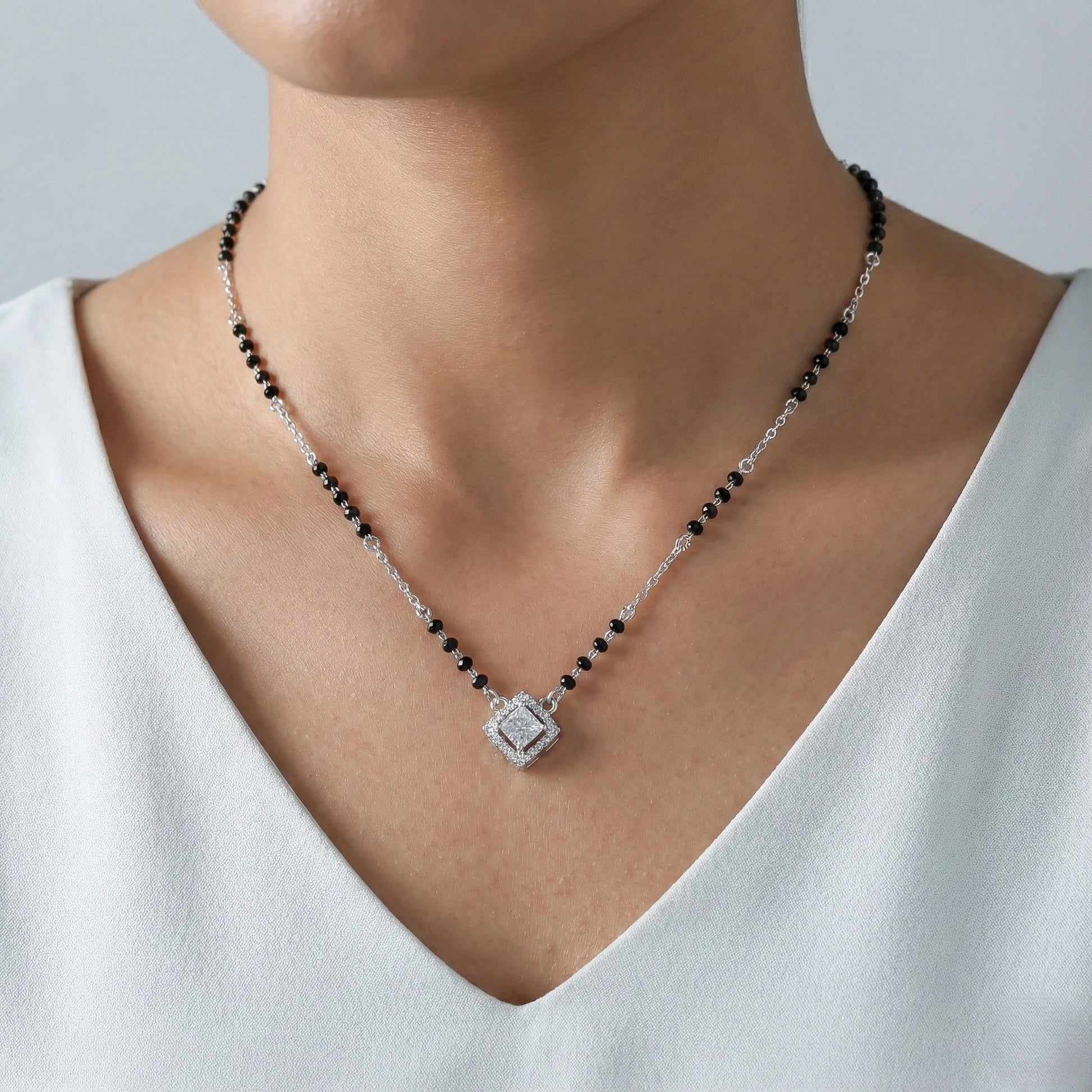 Contemporary mangalsutra with black beads and geometric pendant