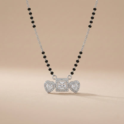 Necklace with heart-shaped pendants on a beige background