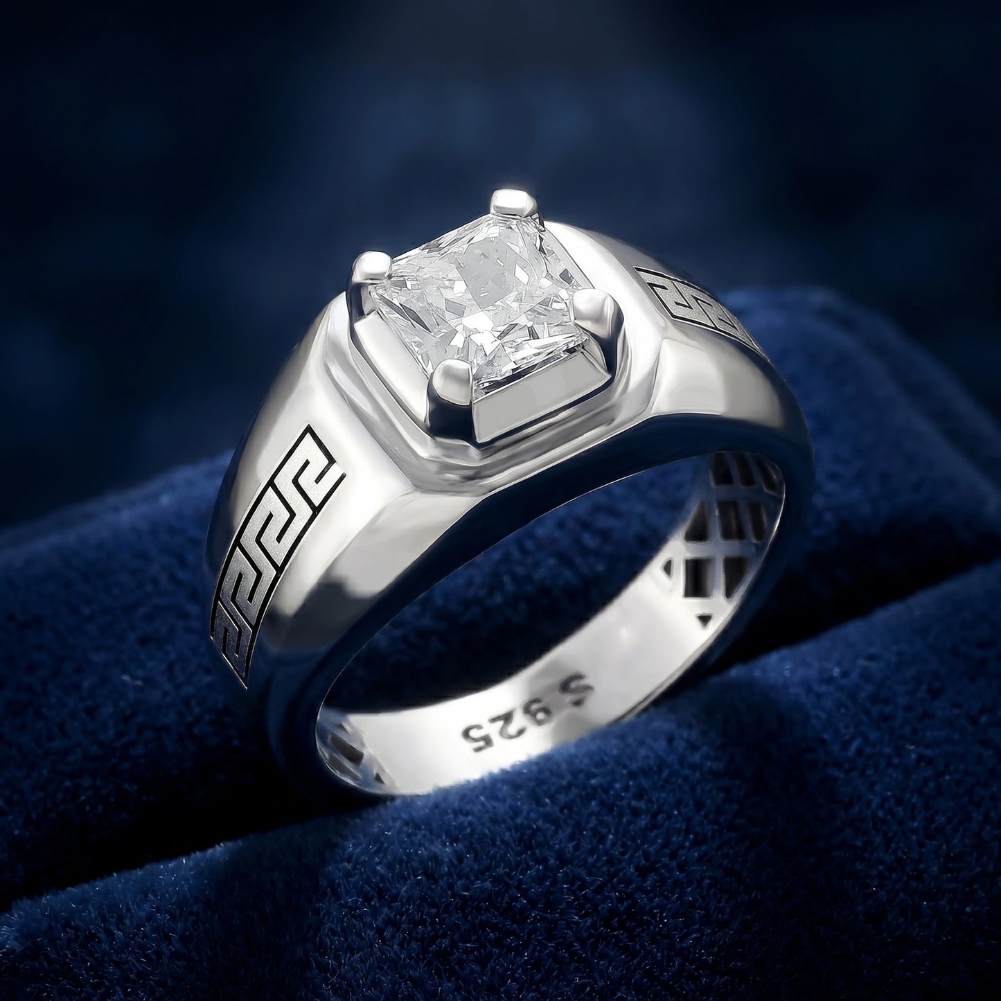 Silver ring with a diamond on a blue velvet background