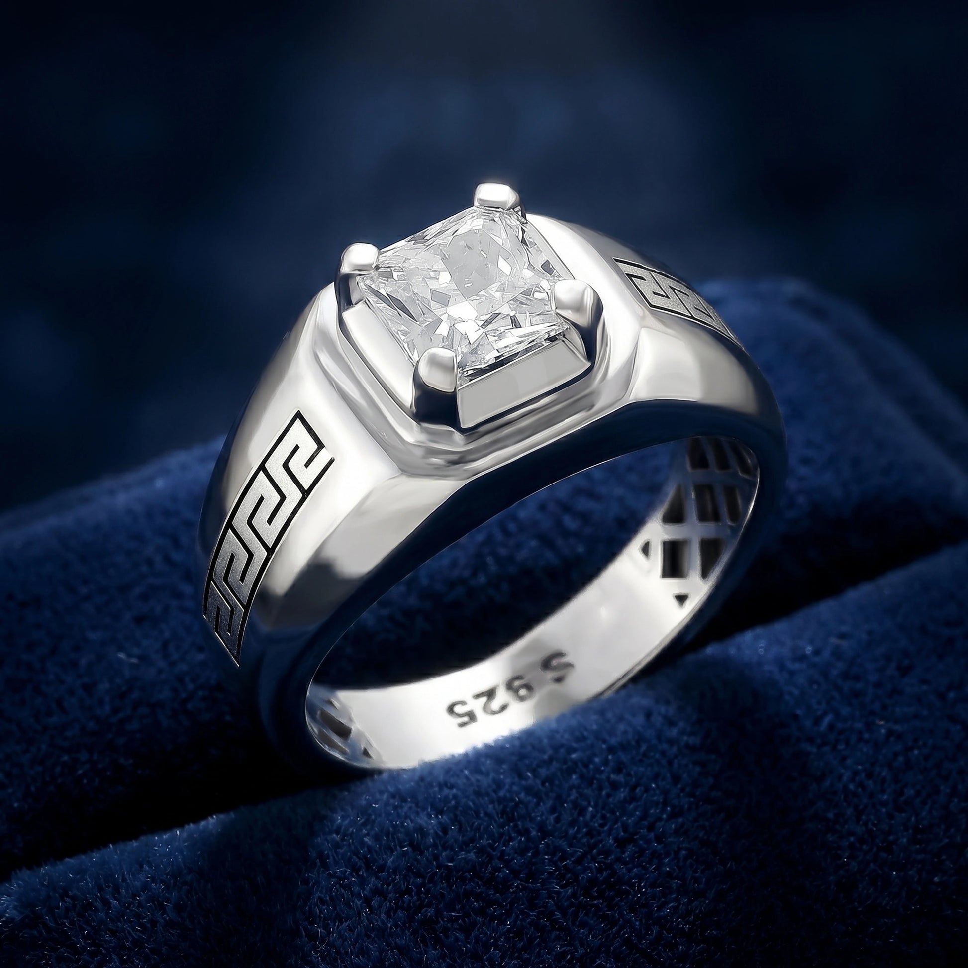 Silver ring with a diamond on a blue velvet background