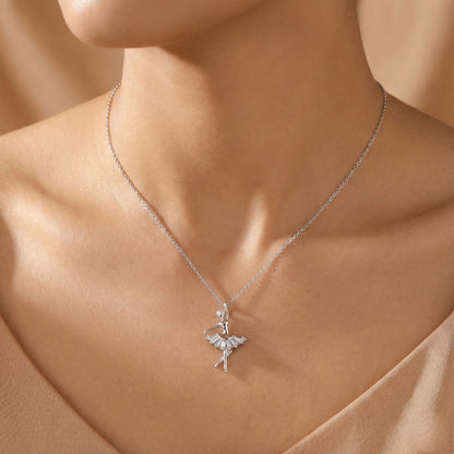 Silver necklace with a ballerina pendant on a model's neck