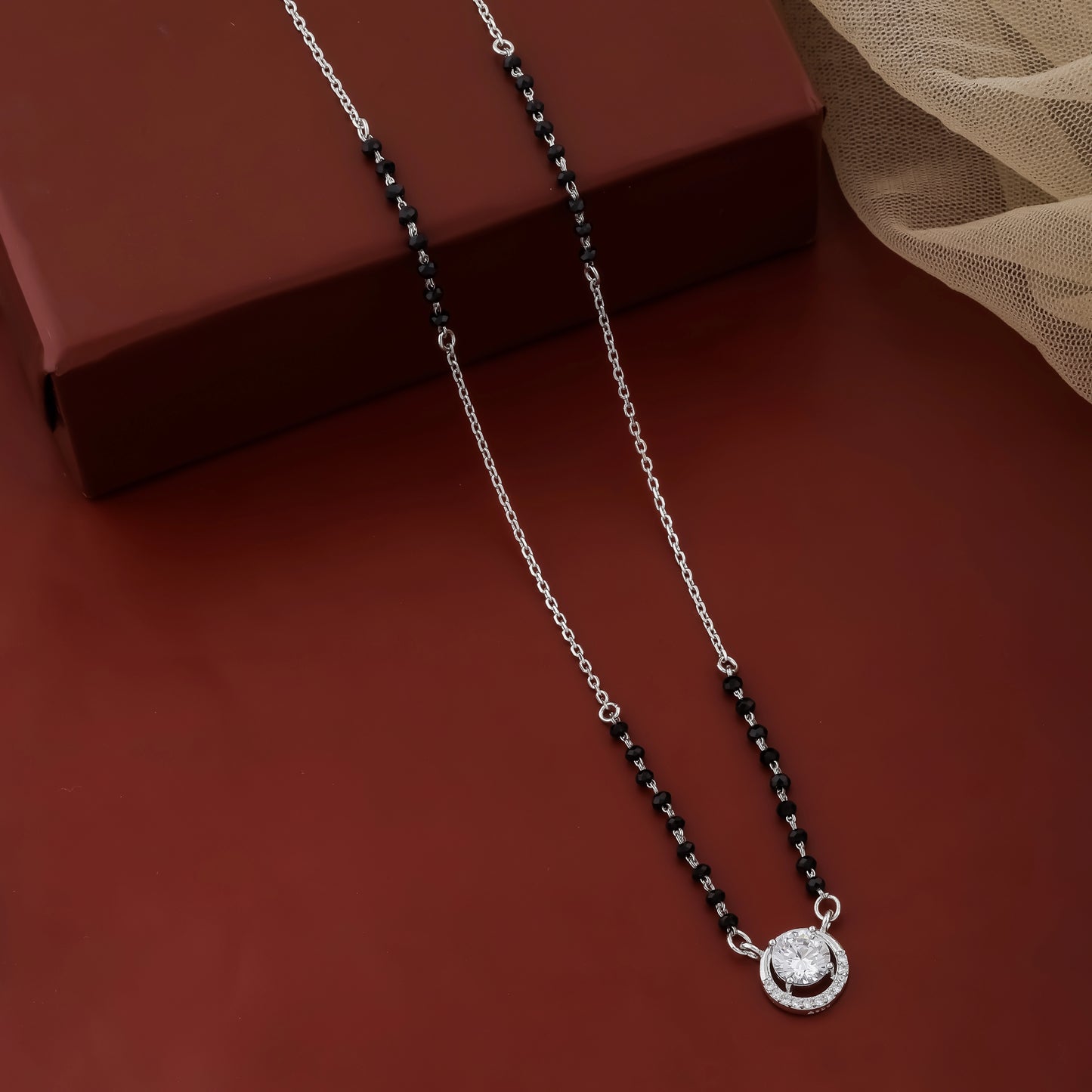 Necklace with a pendant on a brown surface