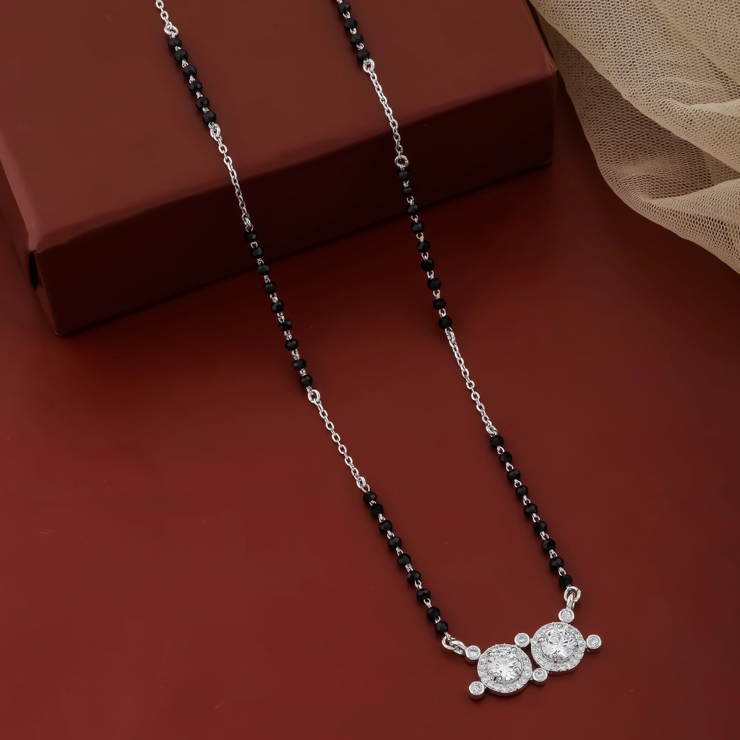 Minimal everyday mangalsutra necklace with black beads and twin round silver pendant