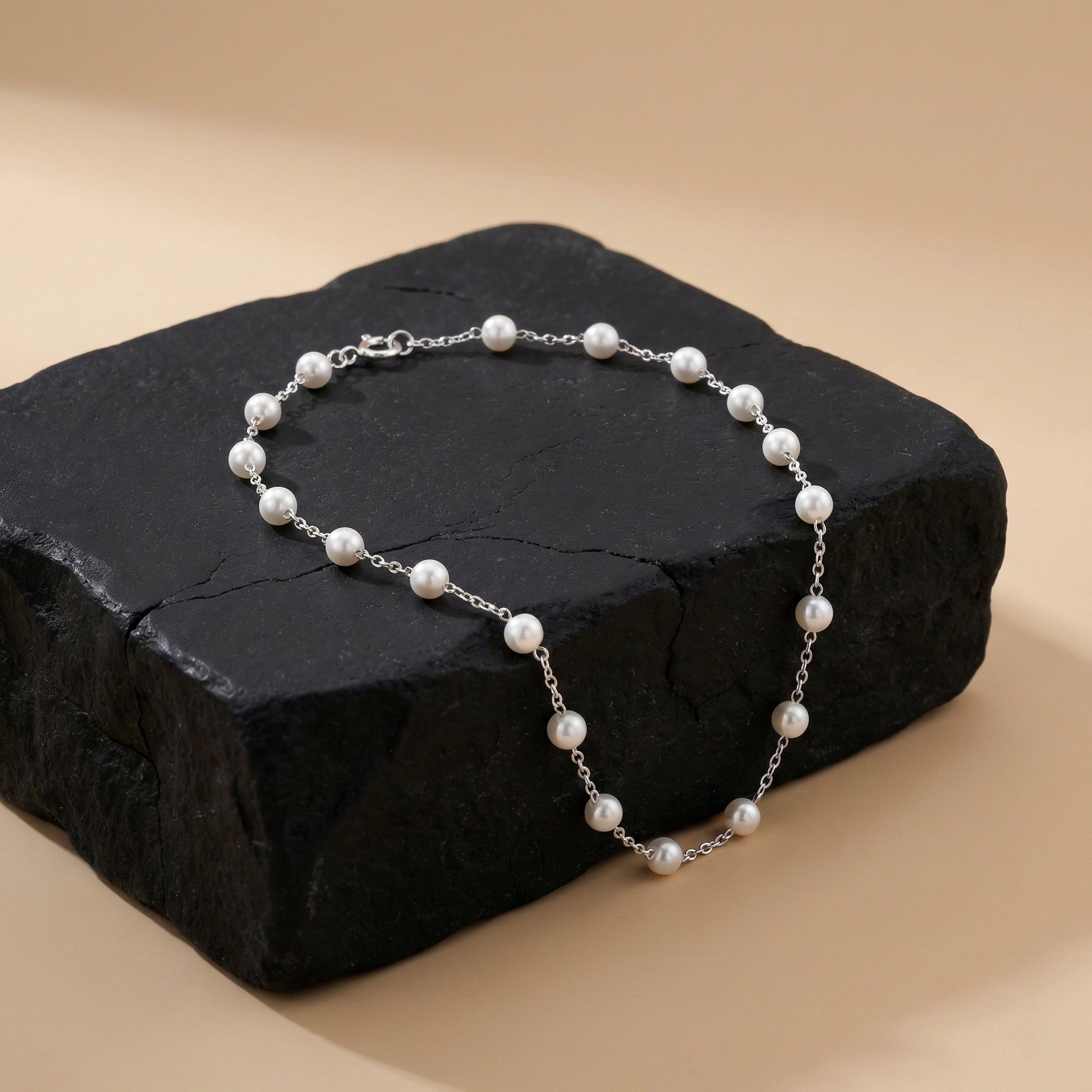 Elegant pearl and silver bracelet product photography