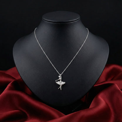 Silver necklace with a ballerina pendant on a black mannequin bust against a dark background.