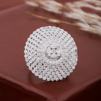 Silver ring with diamond accents on a brown surface