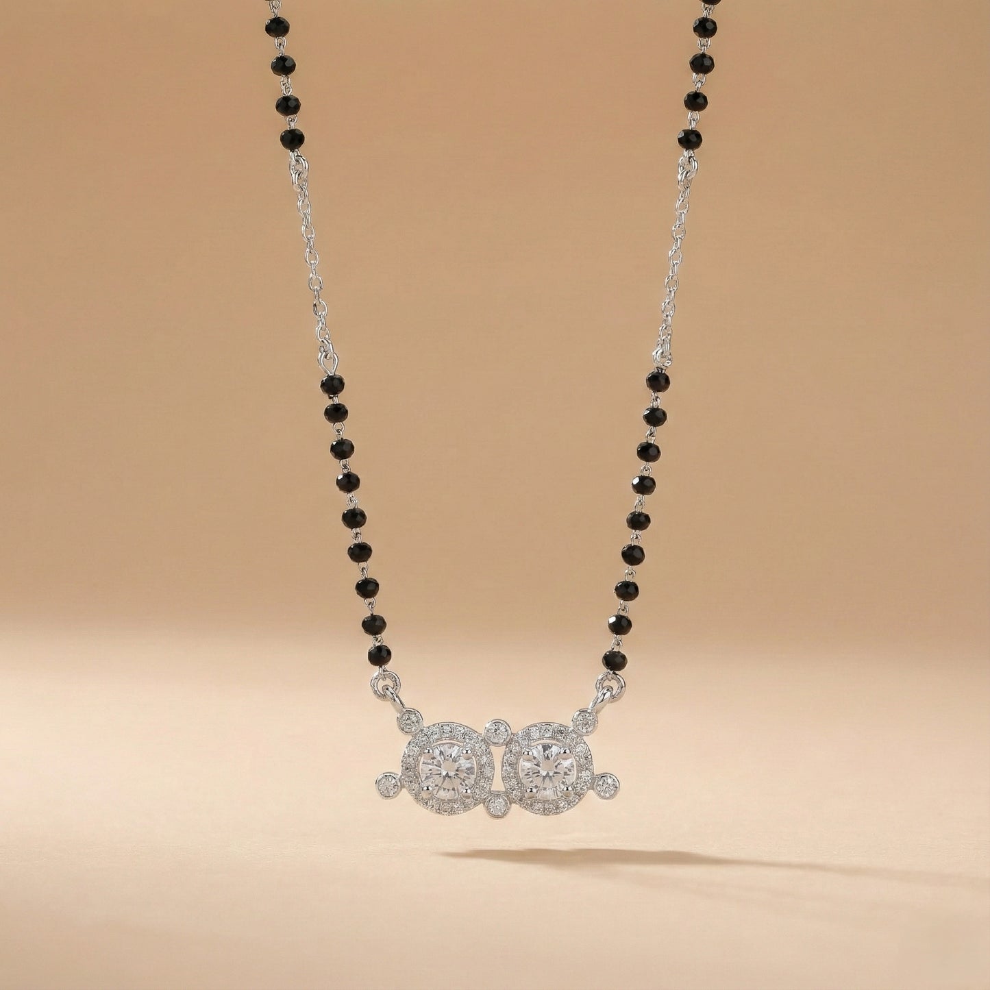 Elegant silver mangalsutra with traditional black beads and sparkling twin circular pendant