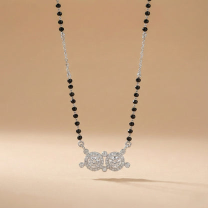 Elegant silver mangalsutra with traditional black beads and sparkling twin circular pendant