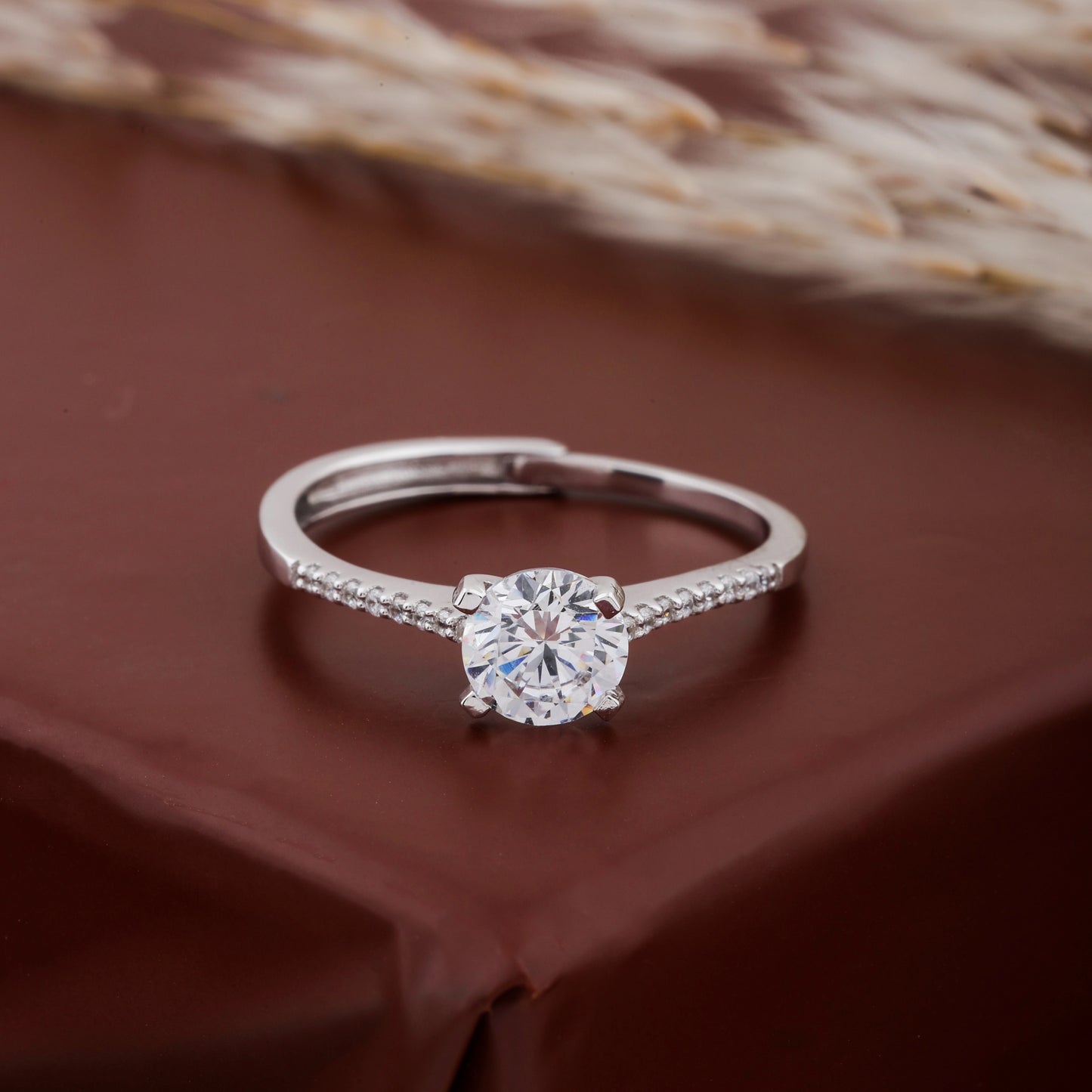 Diamond ring on a brown fabric background
