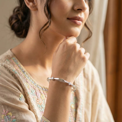 Woman wearing a delicate bracelet, close-up of hand and wrist.