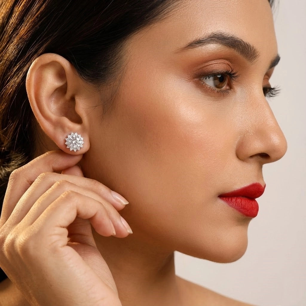 Close-up of a woman wearing a diamond earring with a neutral background